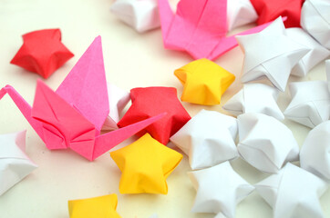 Origami birds with lucky star background