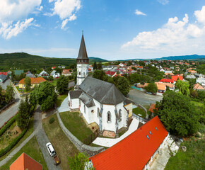 Aerial photo about the Church of the Assumption in Gyongyospata Hungary. Historical religious monument. Built in 12th century romanian baroque and gothic style. popular tourist attraction.