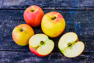 Pile of the ripe apples on wooden table