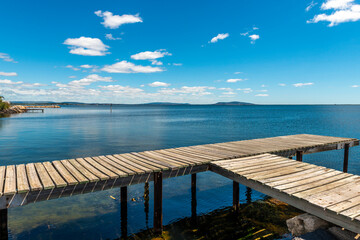 Pontoon on the Etang de Thau in Marseillan and Mont Saint-Clair (Sète) at the far end, in Hérault in Occitanie, France