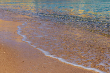 Closeup of the sand on beach and Red sea water
