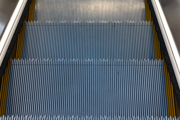 Escalator in metro. Moving up staircase escalator. .Close up to Moving electric escalator.