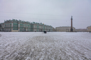 Saint Petersburg / Russia - February 18, 2017:  State Hermitage Museum and Palace square in winter which is full snow cover but tourists are still visiting the palace in the winter. - 357647450