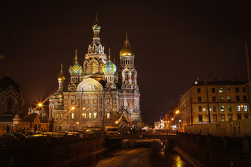 Fototapeta na wymiar Saint Petersburg / Russia - February 18, 2017: Church of Savior on the Spilled Blood at night during where is a famous place for tourist with a beautiful onion dome.