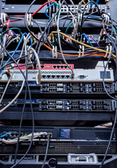 Server room with computers for internet. Network cables connected to switches.