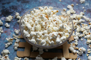  popcorn in a bowl on wooden desk