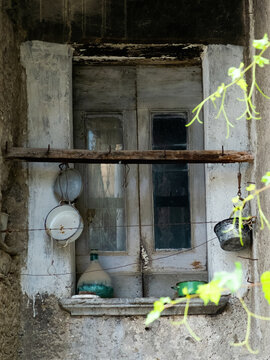 There is a fragment of very old, wooden doors with a rusty doorknob. A concept of obsolete, no sense of prohibitions and obstacles. It can be used as a template, space for an inscription, texture.