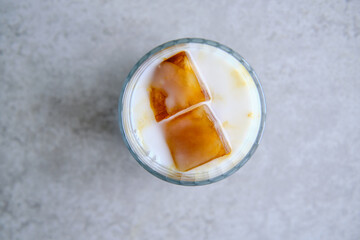 Ice cubes made with coffee in glass, preparing refreshing coffee drink