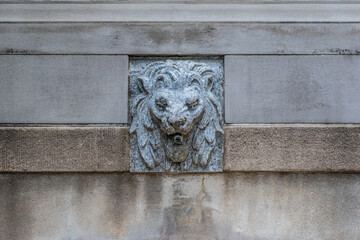 Closeup of stone lion fountain.