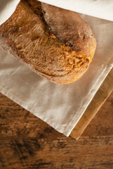 Freshly baked bread wrapped in a towel.