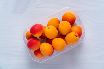 peaches in plastic packaging from a supermarket.