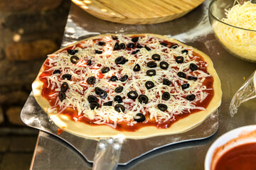 Tasty hot italian pizza with ham, mushrooms and olives.  Traditional Italian food. Concept poster for Restaurants or pizzerias.