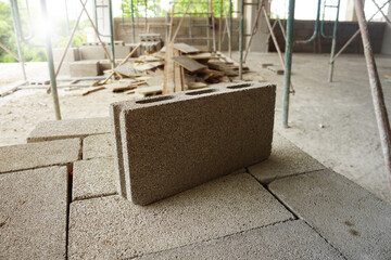 Cement blocks on construction site. Concrete block is made from a mixture of cement and stone and sand. It can bear high compressive strength. - obrazy, fototapety, plakaty