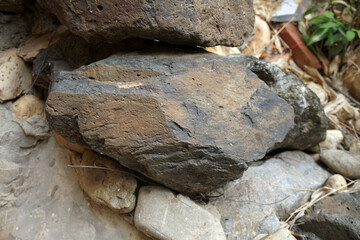 closeup of sample of natural basalt rock. Basalt is an extrusive igneous rock.