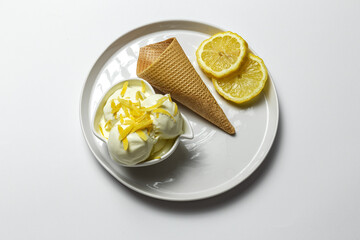 Homemade and refreshing natural lemon ice cream ball in cone