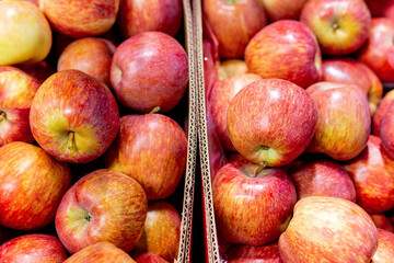 red ripe apples. Ripe apple tree fruits, closeup. Harvest apple s, a bunch of fruits on a shelf in the store.
