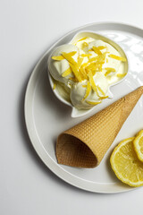 Homemade and refreshing natural lemon ice cream ball in cone