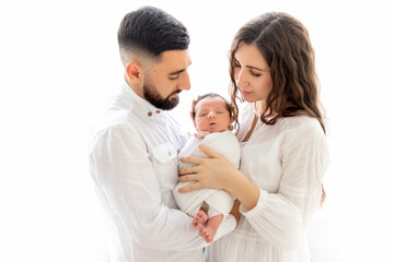 parents hold a newborn child at the window, mom and dad hold their son for 7 days, family day