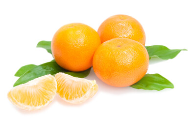 three tangerines and segments with green leaves isolated on white background