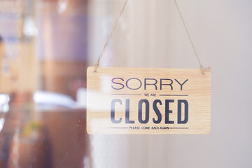 Closed door sign board on the door closed shop due to coronavirus