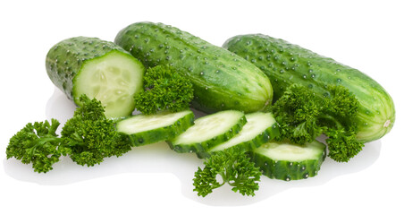 sliced and whole cucumbers with greenage isolated on white background