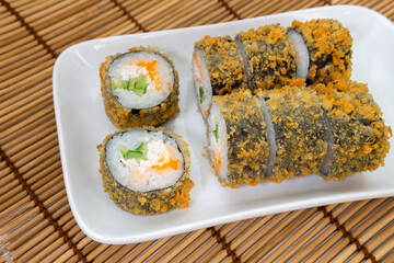 Japanese food restaurant delivery-tempura sushi rolls. Sushi rolls and unagi hot caviar