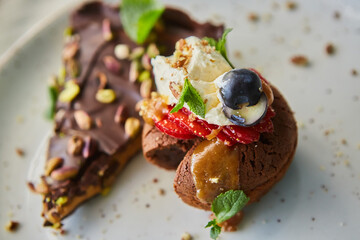 Delicious cupcakes with delicate caramel filling inside, decorated with fresh fruit.