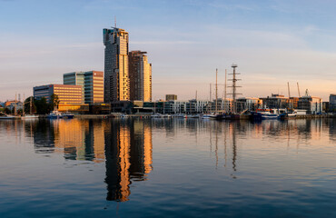 Marina and apartments in Gdynia in Poland illuminated by the rising sun