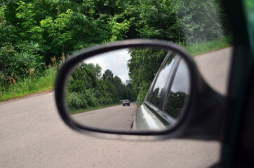 small car appear in the rearview mirror