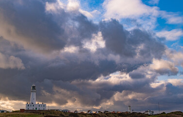 Fototapeta premium Stormy clouds over a lighthouse.