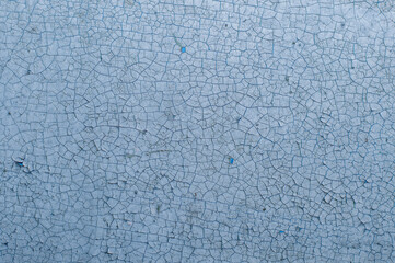 Old painted wall with cracked paint