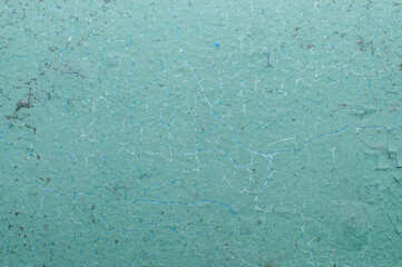 Old painted wall with cracked paint