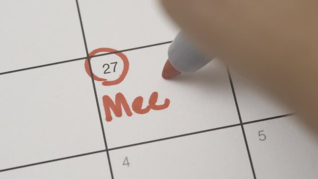 Writing meeting on a calendar agenda date