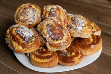 Patties with cottage cheese and raisins folded in a pile on a plate.