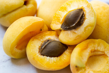 Ripe apricots on a white background closeup photo of seasonal summer fruits