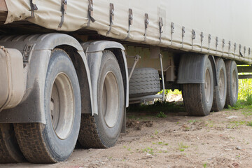 Obraz na płótnie Canvas A car with a trailer for long-distance cargo transportation.
