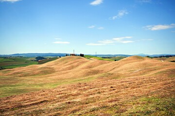 Fototapeta premium natural landscape of the Crete Senesi near Asciano in the Tuscan countryside in Siena, Italy. The Crete Senesi are typical terrain features characterized by gullies, cliffs and biancane.