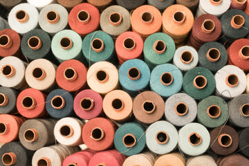 Threads in a tailor textile fabric: colorful cotton threads, birds eye perspective