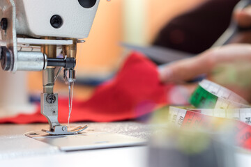 Sewing in a tailor workshop: Close up picture of sewing needle