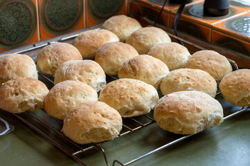 18 homemade buns on a grill