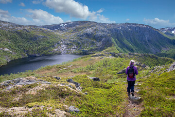 Fototapeta na wymiar Happy women on hike to the Skogmo mountain in great summer weather, Nordland county