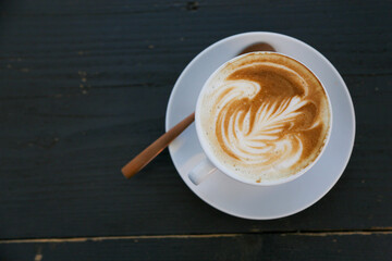 Cappuccino in cup with froth art