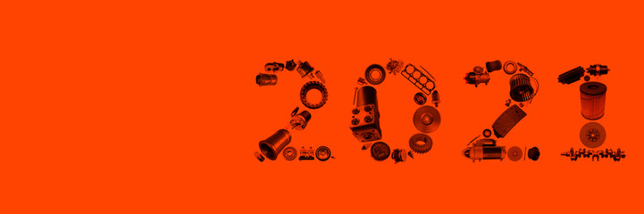 Number 2021 written with truck, tractors and car spare parts.New year concept for repair shop,...
