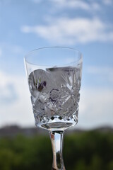 Water in the glass with ice cubes