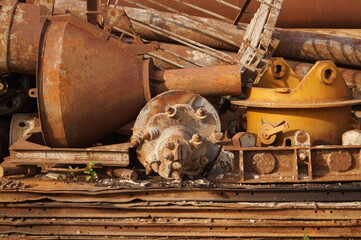 Pile of old rusty scrap metal. Dump. Environmental pollution