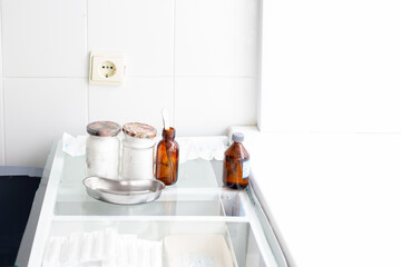 glass tables with medical instruments, cleanliness and sterility