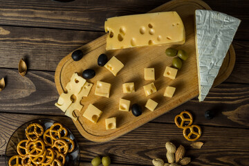 Tasting a cheese dish with herbs, snacks and salt
