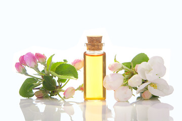 Essence of flowers on table in beautiful glass jar