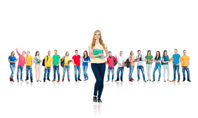 Obraz premium Large group of teenage students isolated on white background. Many different people standing together. School, education, college, university.