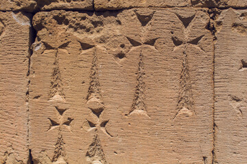 carved cross on the wall of the church